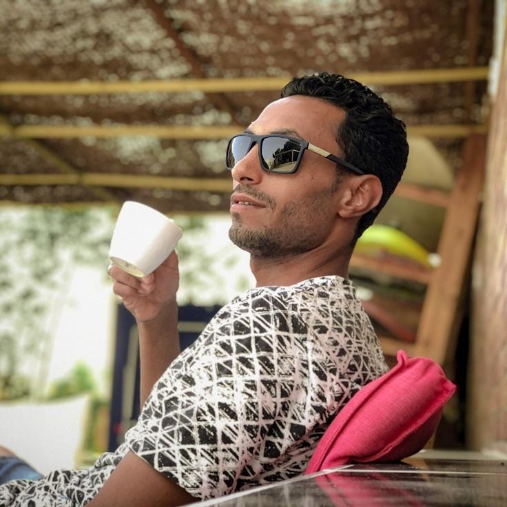 Kaveri Mehta, Lead Design Curator at Stream Line Canvas, reviewing corporate floral arrangements